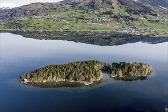 Island with small holiday cottage, lake Hafslovatnet east of town Sogndal, reflections in the lake,