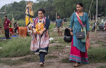 Devotees carries the Ganesha idol to immerse in the Brahmaputra river, during Ganesh Chaturthi