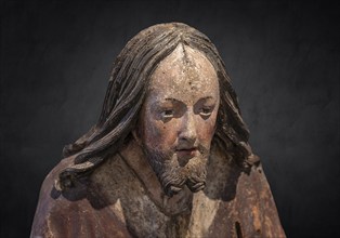 Head of Christ, detail of the Palmesel, wooden figure around 1520, on a dark background, Diözesan