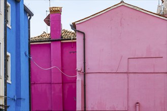 City view of Burano with colourfully painted houses and canals. Burano, Venice, Veneto, Italy,