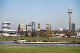 The skyline of Düsseldorf, with the skyscrapers in the Media Harbour, Rhine Tower, in front