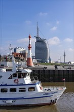 Skyline of Bremerhaven, Atlantic Sail City Hotel skyscraper, excursion boat Geestemünde, leaving