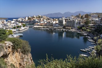 The village of Agios Nikolaos, in the eastern part of Crete, view over Lake Voulismeni, connected