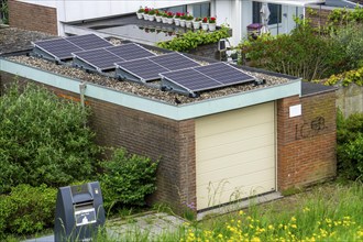 Solar modules on roofs, here on a car garage, Vlissingen, Netherlands