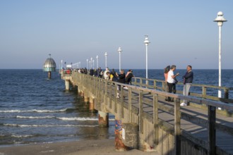 Tourists on the Vineta Bridge, pier with diving gondola, Zinnowitz, Usedom Island, Baltic Sea,