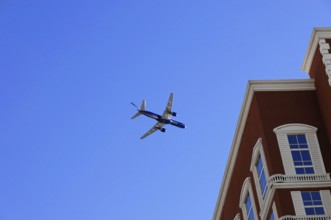 Las Vegas, Nevada, USA, North America, aeroplane in the clear blue sky, next to a large