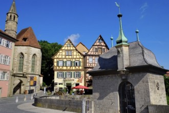 The Henkersbrücke bridge in Schwäbisch Hall spans the River Kocher. Opposite the Johanniter church