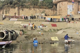 Varanasi, Uttar Pradesh, India, Asia, People on the river bank washing and drying clothes under the