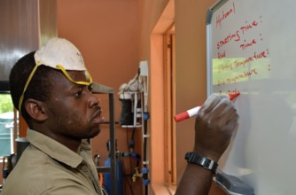 Employee of the Opuwo gum-resin factory at work, Opuwo, Kaokoland, Kunene, Namibia, Africa