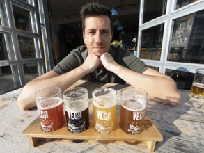 Nathaniel Brinker, 35, owner of the brewery Vega, shows his beer brewed in Gothenburg, Ringön,