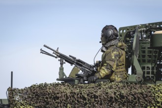 A Czech soldier occupies the hatch of a protected vehicle as part of the military exercise