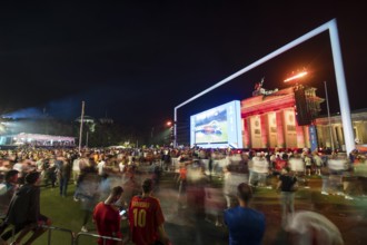 Football fans leaving the fan zone at the Brandenburg Tor after the final match between Spain and