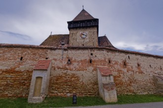 The fortified church of Frauendorf in Transylvania. The church is surrounded by a wall like a