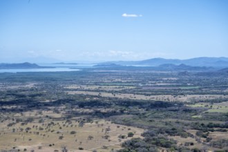 View over dry plain to the sea, Mirador Nacaome, Barra Honda National Park, Costa Rica, Central