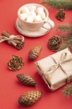 Christmas or New Year composition. Decorations, box, cinnamon, cones, fir and spruce branches, cup