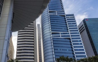 Part of modern building and blue glass skyscapers in Singapore