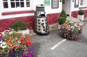 Dr Who Dalek model used as a waste bin, Aldbourne, Wiltshire, England, United Kingdom, Europe