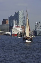 Europe, Germany, Hamburg, Elbe, Cap San Diego, in the background Elbe Philharmonic Hall, fishing