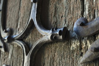 Orcival. Intricate Roman wrought iron hinge displayed at the Basilica Notre-Dame d'Orcival, Puy de