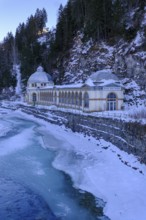 Büvetta Tarasp drinking hall on the Inn or En, Nairs near Scuol in winter, with ice floes, Engadin,