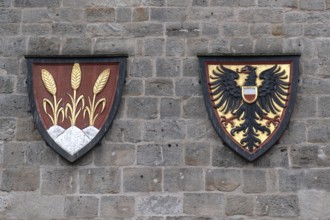 Spelt and imperial eagle in the coat of arms at the Wörnitz Gate, Dinkelsbühl, Bavaria, Germany,