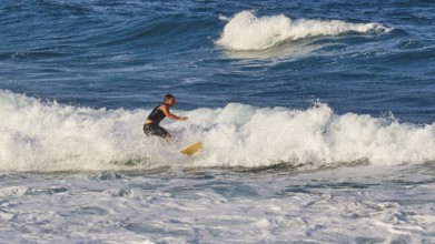 Surfer balancing on a breaking wave, wave surfer, surfer, surf, waves, west coast, Arkasa,