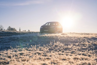 An SUV in a frosty landscape at sunrise, car sharing, electric car, Volkswagen ID 5, Gechingen,