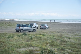 Cars at the beach in Lido di Policoro resort, Basilicata, Mediterranean Sea, Italy, Southern