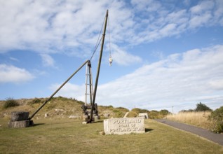 Antique crane forming monument to the quarrying heritage as the 'Home of Portland Stone, Isle of