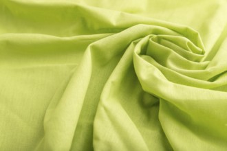 Fragment of green linen tissue. Side view, natural textile background and texture. wave concept,