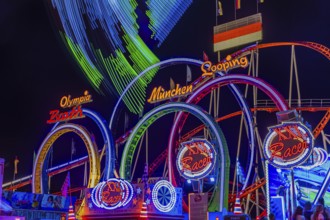 Illuminated ride XXL-Racer, behind the illuminated Olympia five-loop, night shot, Oktoberfest,