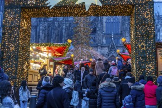 Christmas market at Roncalli Platz am Dom, in the city centre of Cologne, Sunday shopping in