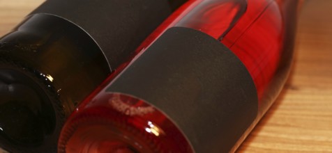 Close-up of two horizontal wine bottles