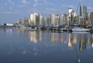 Skyscrapers and boats reflected in the sea at blue hour, downtown, Stanley Park, Vancouver, British