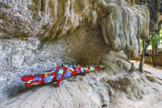 Hiking trail with stuffed animals as sculptures at Phra Nang beach near Krabi, symbol, religion,