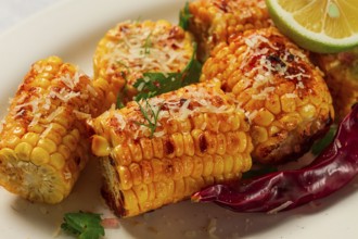 Grilled corn with spices, top view, no people, homemade