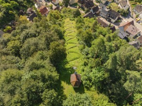 A small cemetery in a wooded area on the edge of a village, seen from above, Gundringen, Nagold,