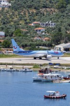 A TUI Airways Boeing 737-800 aircraft with the registration G-TAWD at Skiathos Airport, Greece,