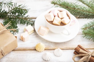 Christmas or New Year composition. Decorations, box, balls, cinnamon, fir and spruce branches, cup