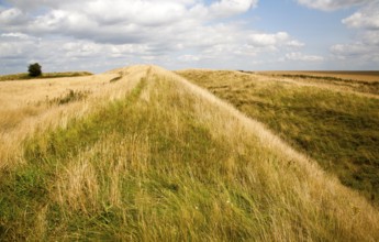 Ditch and earthwork ramparts of prehistoric hill fort of Liddington Castle, Wiltshire, England, UK