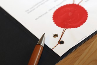 Notarised contract with red official seal