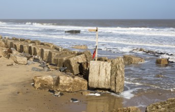 March 20 2018 Hemsby, UK. Coast path sign left abandoned by coastal erosion at Hemsby, Norfolk,