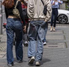 Young couple in jeans, Berlin, Germany, Europe