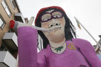 Papier-mâché figure smoking a joint, cannabis legalisation theme, themed float on the Rose Monday