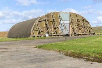 Aircraft hangar for jet fighter military planes, former USAF base, Bentwaters Park, Suffolk,