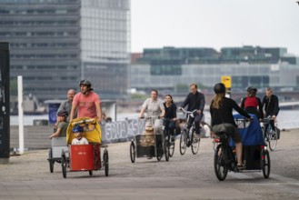 Cyclists on the Bryggebroen cycle and footpath bridge over the harbour, Sydhavnen, Copenhagen is