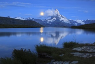 Matterhorn and mountain lake, Stellisee, Valais, Switzerland, full moon, Europe