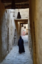 Local Veiled Woman in the Old City of AlUla, Medina Province, Saudi Arabia, Arabian Peninsula, Asia