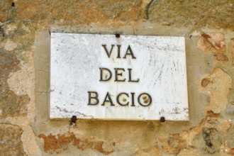 Street sign Via del Bacio, Road of the Kiss, Pienza, Val d'Orcia, Orcia Valley, Tuscany, Italy,