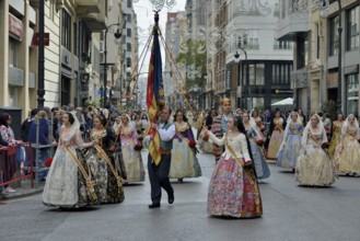 Fallas festival, parade, flower offering, at Plaza de la Virgen de los Desamparados, Valencia,